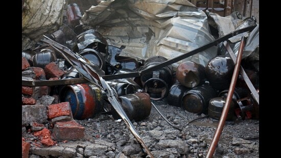 At least 20 cylinders containing Liquefied Petroleum Gas (LPG) exploded after a fire that started in a unit in Katraj on Tuesday. (Ravindra Joshi/HT PHOTO)