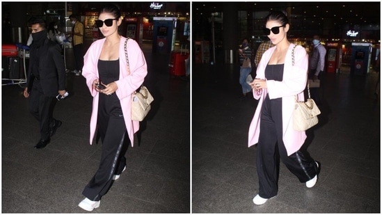 Mouni Roy carried a beige long chain bag that is big enough to fit her passport, phone, wallet and other personal belongings.(HT Photo/Varinder Chawla)