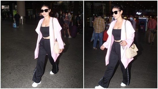 Mouni Roy also wore a pair of chic black sunglasses so that the camera doesn't capture those tired baggy eyes. Those shades also elevated her overall look.(HT Photo/Varinder Chawla)