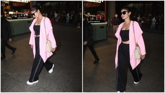 Being comfortable while travelling is every traveller's number one priority. Celebrities have to make sure they keep it stylish yet comfy while travelling so that they don't get clicked looking dull. Mouni Roy chose the perfect airport look for her long international travel.(HT Photo/Varinder Chawla)