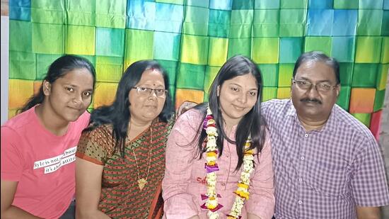 Kritika Singh, a medical student who returned to Varanasi from Ukraine, with her parents. (HT Photo)