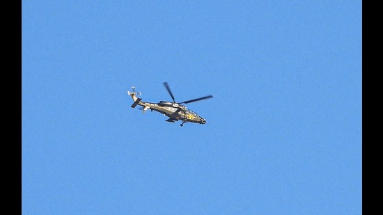 A light combat helicopter (LCH) developed by Hindustan Aeronautics Limited, deployed to assist IAF for high altitude operations, flies over Ladakh region, in Leh on August 13, 2020. (PTI)