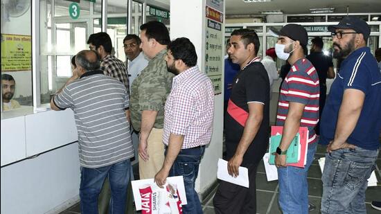 City residents queue up to deposit property tax at Zone D Suvidha Kendra in Ludhiana on Wednesday. (Harsimar Pal Singh/HT)