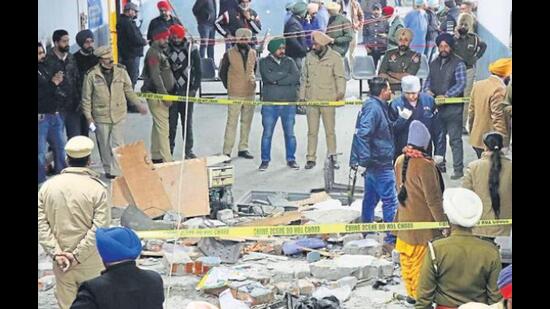 Police cordoning off the Ludhiana court blast site on December 23, 2021. Main accused Gagandeep Singh, a dismissed Punjab Police constable, died while allegedly planting the bomb. (HT file photo)