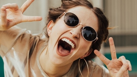 Smiling helps you to fortify your immune system as you release endorphins in your body which help you to feel relaxed, less anxious and also reduce pain in the body.(Unsplash)