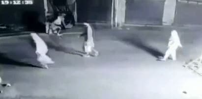 Passersby can be seen running to safety after the bomb was thrown and security personnel immediately came out of the bunker to douse the fire with buckets of water. (ANI Photo)