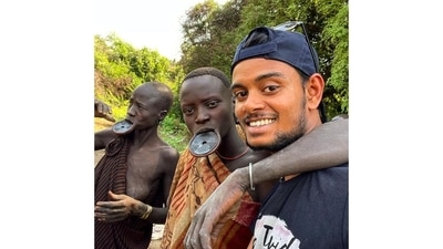 Yadav with members of the lip-plate-wearing Mursi tribe in Ethiopia. He travelled across Africa for nine months last year. The lip plates are worn as a symbol of beauty and resilience.&nbsp; 
