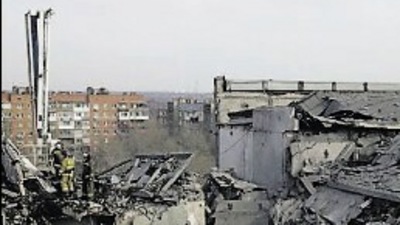 Firefighters work at a residential building damaged by &nbsp;shelling in the separatist-controlled city of Donetsk, Ukraine (Reuters)