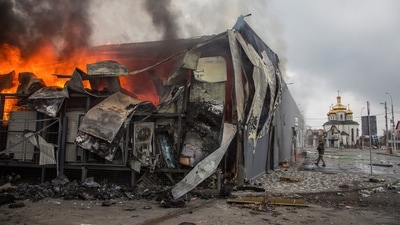 Fire burns in a building after a shelling, as Russia's attack on Ukraine continues, in the town of Irpin, Kyiv region. (Reuters)