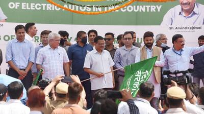 Delhi chief minister Arvind Kejriwal and transport minister Kailash Gahlot flag off electric auto-rickshaws at IP Depot in New Delhi on Thursday. (Sanchit Khanna/HT Photo) Delhi chief minister Arvind Kejriwal and transport minister Kailash Gahlot flag off electric auto-rickshaws at IP Depot in New Delhi on Thursday. (Sanchit Khanna/HT Photo)