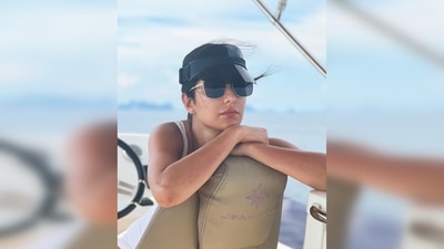 The next still is of Katrina Kaif sitting on the sailor's seat with her shades and Dior sunhat. (Instagram/@katrinakaif)