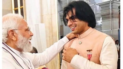 Neeraj Chopra poses with PM Narendra Modi in blush pink kurta pyjama and jacket by Sabyasachi in this pic: See here Neeraj Chopra poses with PM Narendra Modi in blush pink kurta pyjama and jacket by Sabyasachi in this pic: See here