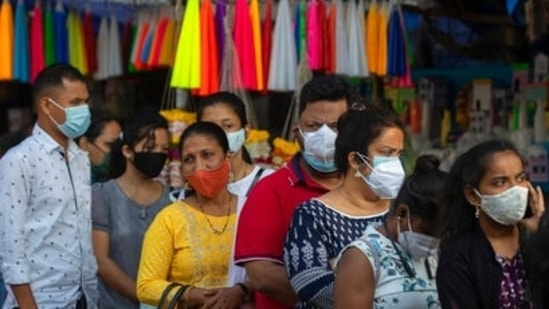 People wearing face masks in Mumbai.