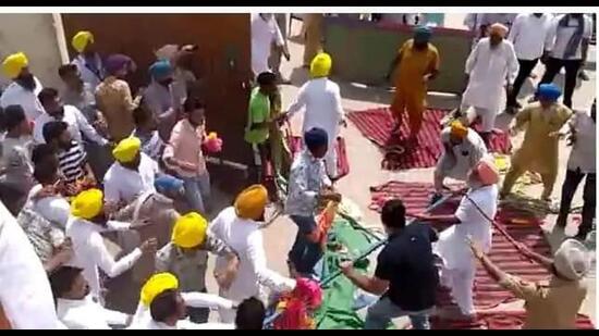 A group of 60 truck operators protesting at the gate locked the door from inside, which escalated t tension among both groups. (HT PHOTO)