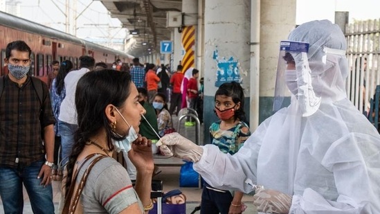 File photo of a health worker collecting swab sample at a station in Maharashtra.(Pratik Chorge/HT Photo)