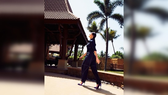 Accessorised with gold half hoop earrings, Mrunal Thakur accessorised her look with purple high heel pumps.(Instagram/@mrunalthakur)