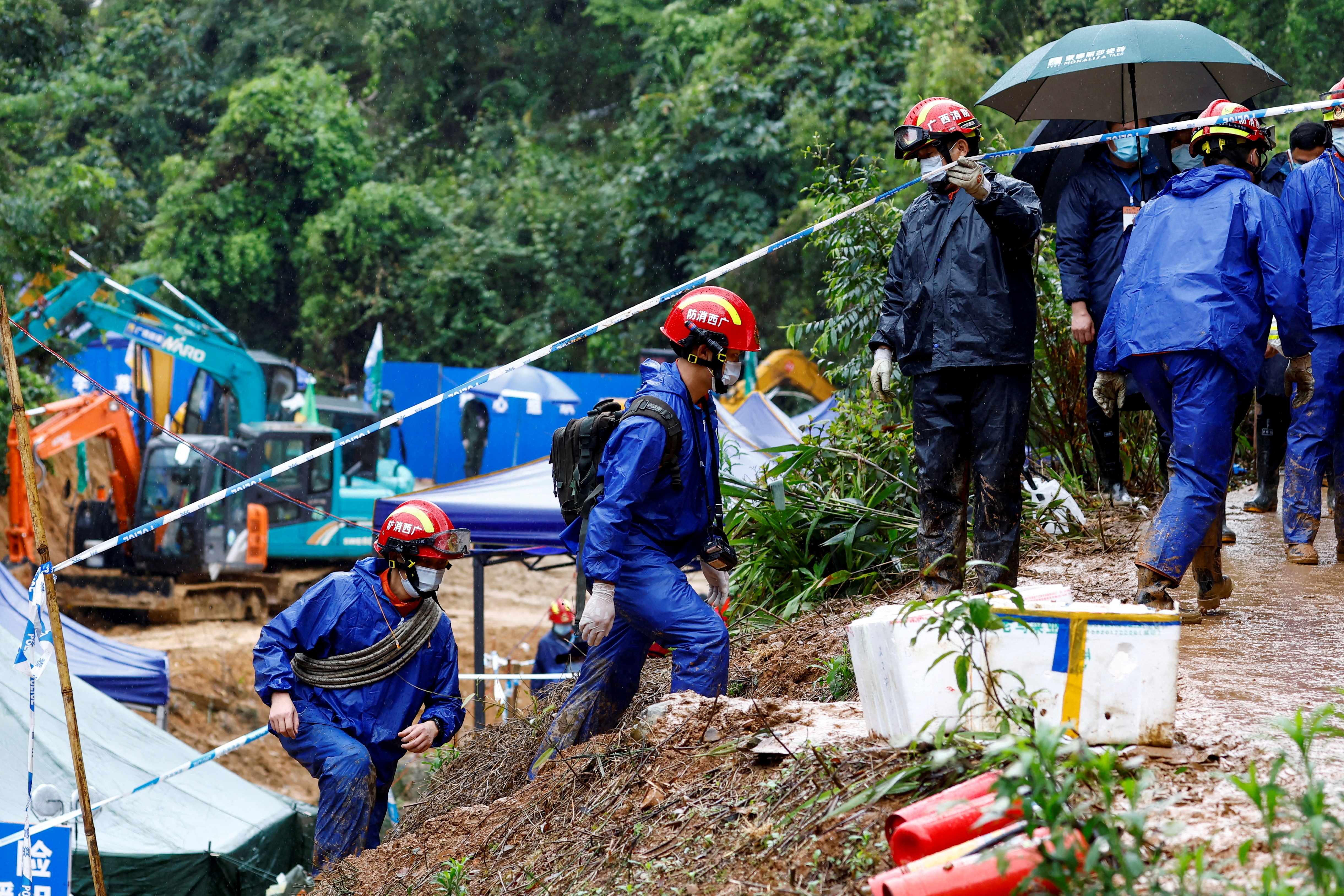 Rescue workers work at the site where a China Eastern Airlines Boeing 737-800 plane flying from Kunming to Guangzhou crashed, in Wuzhou, Guangxi Zhuang on March 24, 2022.&nbsp; (Reuters Photo)