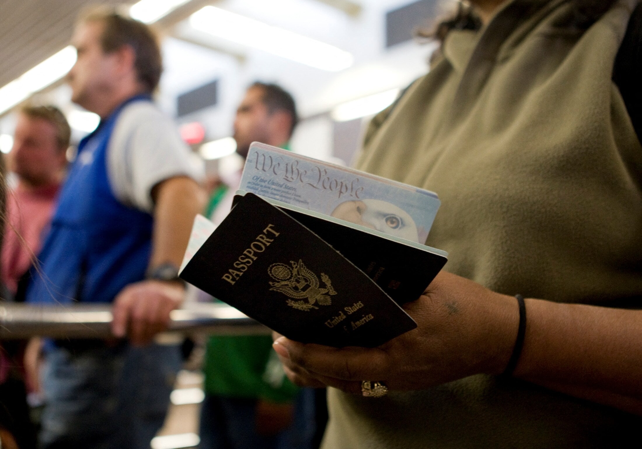A pedestrian holds passports while waiting to cross into the United States from Mexico at the San Ysidro border crossing in San Ysidro, California. (REUTERS/Fred Greaves/File Photo)