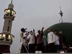 Muslim men look for the position of the moon to mark the first day of the holy fasting month of Ramadan on the roof of Al-Musyari'in mosque in Jakarta, Indonesia, April 1, 2022.&nbsp;