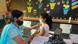 A healthcare worker administers a dose of the Covid-19 vaccine to a student in the age group of 12-14 years.  (PTI)