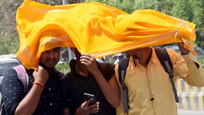 Students try to protect themselves from the scorching heat. (ANI PHOTO) Students try to protect themselves from the scorching heat. (ANI PHOTO)