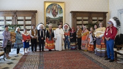 Indigenous delegates from Canada's First Nations pose for a photo with Pope Francis during a meeting at the Vatican. (via REUTERS)
