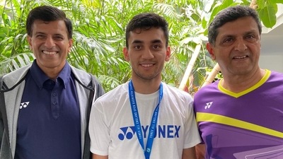 Lakshya Sen (centre) with Prakash Padukone (right) and Vimal Kumar. Lakshya Sen (centre) with Prakash Padukone (right) and Vimal Kumar.