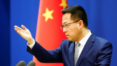 China's foreign ministry spokesperson Zhao Lijian attends a news conference in Beijing, China. (REUTERS)