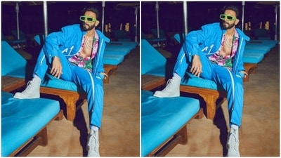 Ranveer put his sartorial foot forward and chose to go with a multicoloured shirt and set major beach fashion goals. The shirt, showing off his chest, came in quirky shades of pink, white and green. (Instagram/@ranveersingh)