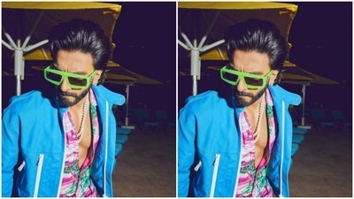 In back brushed gel hairdo and white beaded neck chain, Ranveer set the fashion bar higher for us. (Instagram/@ranveersingh)