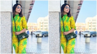 Hina paired a yellow and green printed cropped top with a pair of high-waisted trousers of the same shade. Her top came with pleat details. (Instagram/@realhinakhan)