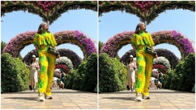 With a mossy green sling bag, Hina posed in Miracle Garden in Dubai. (Instagram/@realhinakhan)