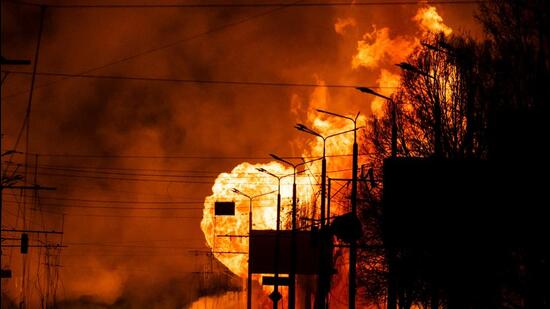 A gas station burns after Russian attacks in the city of Kharkiv, Ukraine on Wednesday. (AFP)