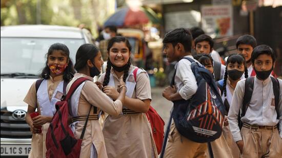 Students leave after school at Karol Bagh in New Delhi, on Friday. (Sanchit Khanna/HT)