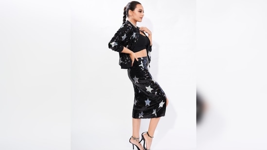 Sonakshi Sinha's outfit comes with a shimmery jacket and slit skirt which she teamed with a black crop top.(Instagram/@aslisona)