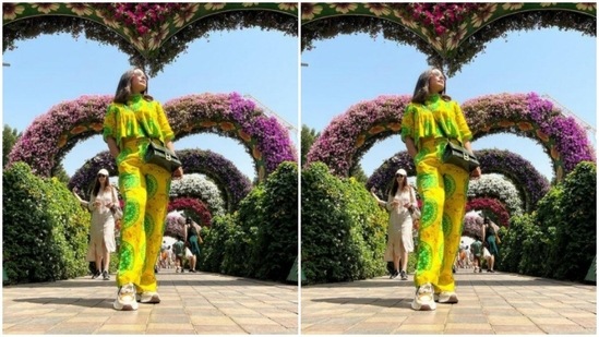 With a mossy green sling bag, Hina posed in Miracle Garden in Dubai.(Instagram/@realhinakhan)