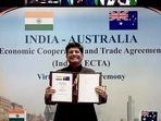 Union Minister of Commerce and Industry Piyush Goyal shows the virtually signed agreement of the India-Australia Economic Cooperation and Trade Agreement (IndAus ECTA) witnessed by Prime Minister Narendra Modi and Australian Prime Minister Scott Morrison, in New Delhi on Saturday. (ANI Photo) Union Minister of Commerce and Industry Piyush Goyal shows the virtually signed agreement of the India-Australia Economic Cooperation and Trade Agreement (IndAus ECTA) witnessed by Prime Minister Narendra Modi and Australian Prime Minister Scott Morrison, in New Delhi on Saturday. (ANI Photo)