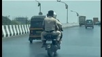 The grab from a 40-second video that went viral in which police personnel were riding triples on a two-wheeler, thus violating traffic rules, on the Mumbai-Pune Highway. The Navi Mumbai traffic police have levied a fine on the rider. (HT PHOTO) The grab from a 40-second video that went viral in which police personnel were riding triples on a two-wheeler, thus violating traffic rules, on the Mumbai-Pune Highway. The Navi Mumbai traffic police have levied a fine on the rider. (HT PHOTO)