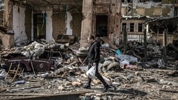 A man walks in the rubble of a destroyed building in the eastern Ukraine city of Kharkiv.