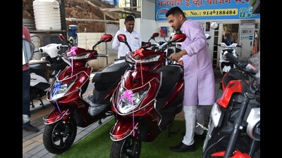 The spurt in petrol and diesel prices has potentially accelerated the shift to electric vehicles in the city. On the occasion of Gudi Padwa, people were seen purchasing electric vehicles at Rajyog e-bike. Walhekarwadi. Chinchwad on Saturday. (HT PHOTO) The spurt in petrol and diesel prices has potentially accelerated the shift to electric vehicles in the city. On the occasion of Gudi Padwa, people were seen purchasing electric vehicles at Rajyog e-bike. Walhekarwadi. Chinchwad on Saturday. (HT PHOTO)