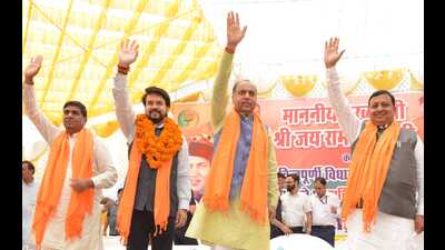 Union minister Anurag Thakur (second from left) and Himachal CM Jai Ram Thakur (centre) while addressing a public gathering in Chintpurni on Saturday. (HT Photo)