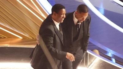 Denzel Washington with Will Smith at the 94th Academy Awards.