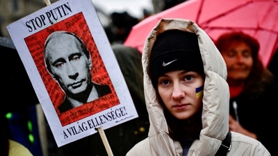 A woman takes part in a demonstration in support of Ukraine, amid Russia's invasion of Ukraine, in Budapest, Hungary. (REUTERS)