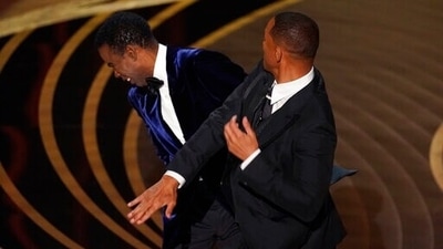 Will Smith hits presenter Chris Rock on stage while presenting the award for best documentary feature at the Oscars on March 27. (AP Photo) (Chris Pizzello/Invision/AP) Will Smith hits presenter Chris Rock on stage while presenting the award for best documentary feature at the Oscars on March 27. (AP Photo) (Chris Pizzello/Invision/AP)