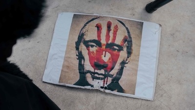 This photograph taken in Belgrade on March 20 shows a placard depicting Russian President Vladimir Putin during a rally against Russia's military invasion on Ukraine. File photo. ((Photo by Vladimir Zivojinovic / AFP)) This photograph taken in Belgrade on March 20 shows a placard depicting Russian President Vladimir Putin during a rally against Russia's military invasion on Ukraine. File photo. ((Photo by Vladimir Zivojinovic / AFP))