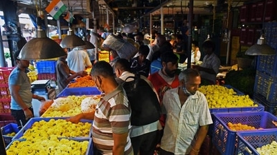 People shopping at flower market for Gudi Padwa at Dadar on Friday. (ANI)