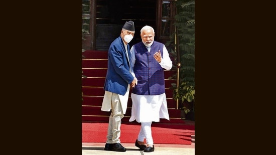 Prime Minister Narendra Modi and Prime Minister of Nepal Sher Bahadur Deuba exchange greetings at Hyderabad House in New Delhi, on Saturday. (Hindustan Times)