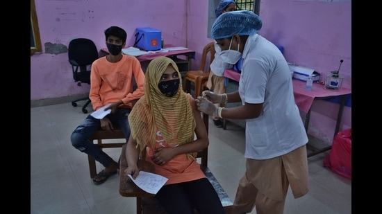 Teenage beneficiaries get inoculated against Covid-19 at a Vaccination Centre. (HT PHOTO)