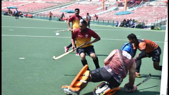 Accountant general (AG) Delhi thrashed AG Himachal Pradesh 8-0 in the opening match of the North Zone Hockey Tournament at the Sector 42 stadium. (HT PHOTO )