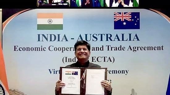 Union Minister of Commerce and Industry Piyush Goyal shows the virtually signed agreement of the India-Australia Economic Cooperation and Trade Agreement (IndAus ECTA) witnessed by Prime Minister Narendra Modi and Australian Prime Minister Scott Morrison, in New Delhi on Saturday. (ANI Photo)